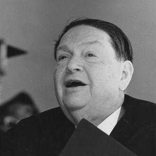 Elderly Darius Milhaud holding score with mouth agape.