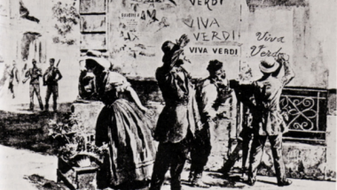 A sepia image of townspeople gathered in a town square, standing before a wall with 'Viva Verdi' written on it several times.