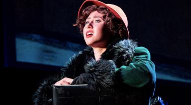 Girl in green fur coat and pink hat