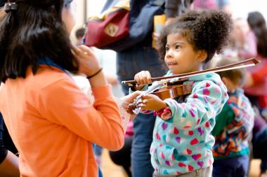 Community Music Day includes a String Instrument Petting Zoo, where little kids can touch and play violins and other string instruments.