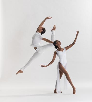 Two dancers in white attire