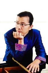 Piano virtuoso Frederic Chiu leans on piano