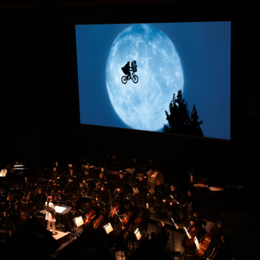 Symphony San Jose performs John Williams' Academy Award-winning score while film plays above the stage.