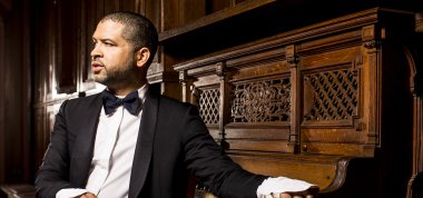 Jason Moran sitting in front of a piano