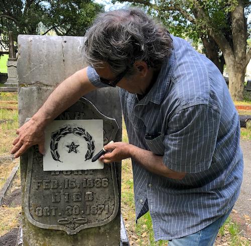 Colin Herrick making a grave rubbing