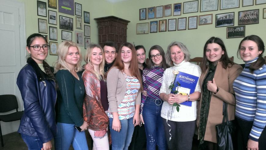 Marika Kuzma with high school choir students