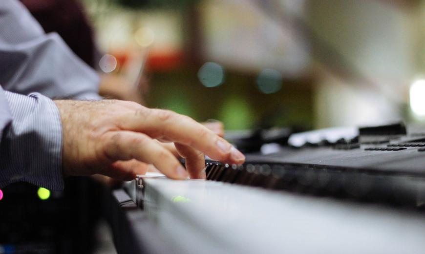 Fingers on piano