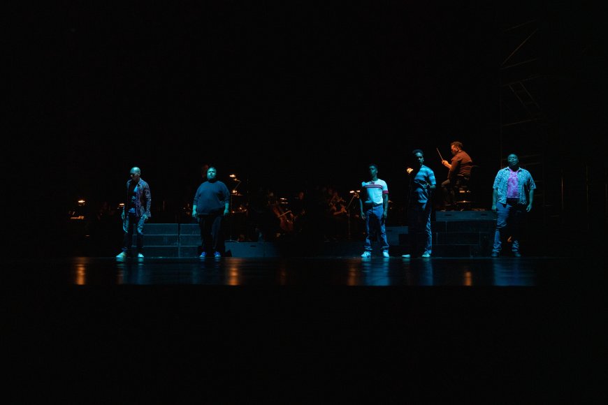 The Central Park Five cast with conductor Anthony Parnther | Credit: JJ Geiger
