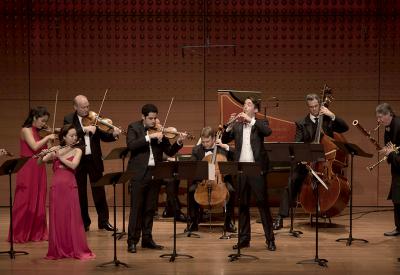 Chamber Music Society performs on stage with their instruments.