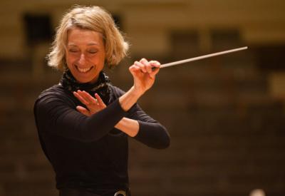 Conductor Nicole Paiement using a baton