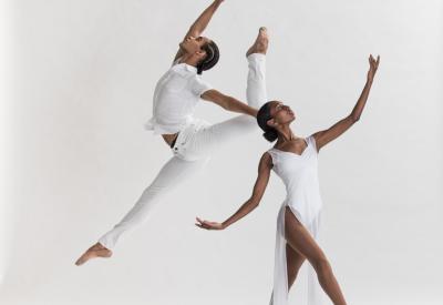 Two dancers in white attire