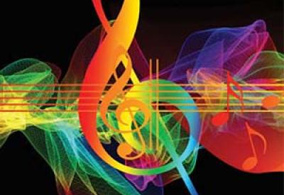 Colorful treble key over musical notes