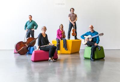 Left Coast Chamber Ensemble Musicians, in order: Michel Taddei, Stacey Pelinka, Phyllis Kamrin, Kurt Rohde, Michael Goldberg, in order on colorful blocks against a gray neutral background