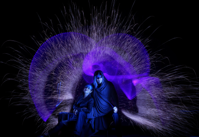 Purple and blue light painted image with two blue faced Lissians