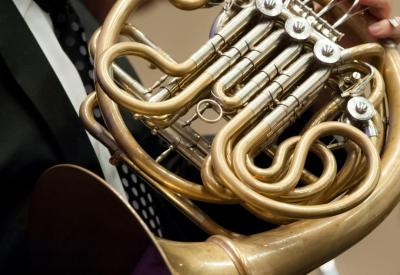 Close-up of french horn in an orchestra