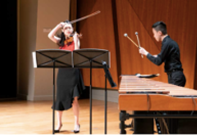The Colburn School Contemporary Ensemble students perform on stage.