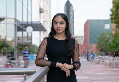 A Colburn Community student posing in the Colburn Plaza.
