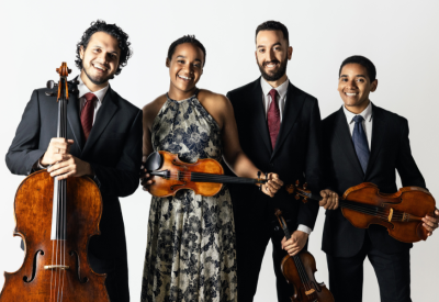 Ivalas Quartet holding their instruments and wearing formal attire