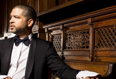 Jason Moran sitting in front of a piano
