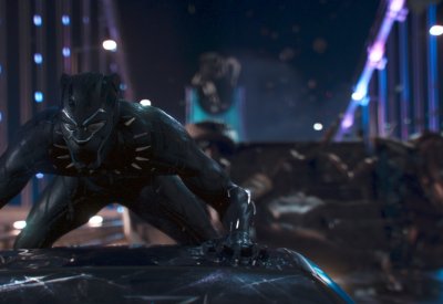 An image of the Marvel character Black Panther on top of a car