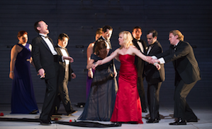 Charon (Matthew Scollin) denies entrance to a soul without a coin (Suzanne Rigden)