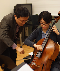 Festival co-director Wei He of SFCM coaches a student from Shanghai<br> Photos by Victor Xie Festival co-director Wei He of SFCM coaches a student from Shanghai Photos by Victor Xie