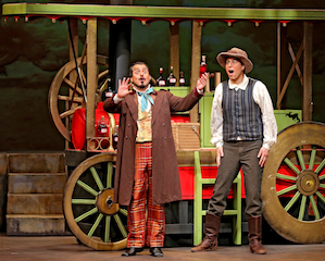 Dulcamara (Igor Vieira) and Nemorino (Chester Pidduck) get the elixir ready Photos by Otak Jump