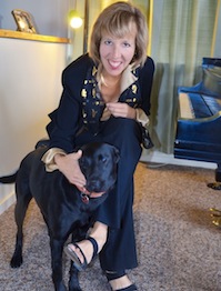Lisa Spector with her dog Gina at the piano Lisa Spector