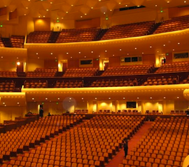 A solitary figure inside the empty hall Davies Hall