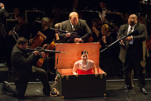 Zanda Svede, as Isabelle, popped out of the box guarded by Pene on the left, Savage on the right
