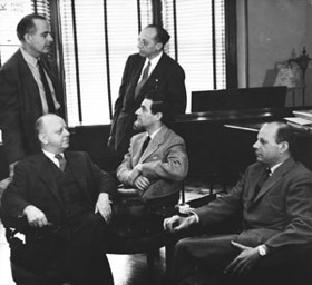 (Clockwise from bottom left) Virgil Thomson,<br>Samuel Barber, Aaron Copland,<br>Gian Carlo Menotti (seated, center),<br> and William Schuman
