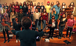 Susan McMane leading the Young Women's Choral Project McMane