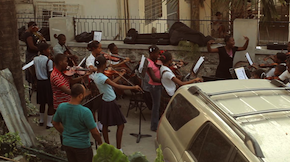 In Haiti, string rehearsal in a parking lot<br>Photo by Owsley Brown Presents Sing With Haiti